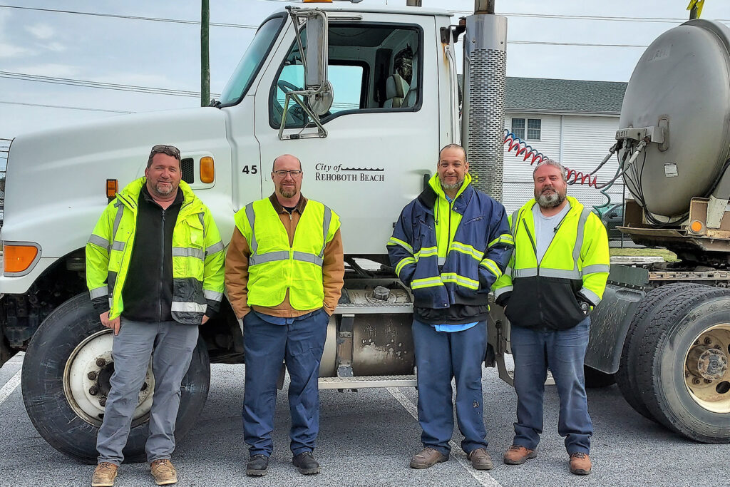 city staff standing in front of a semi