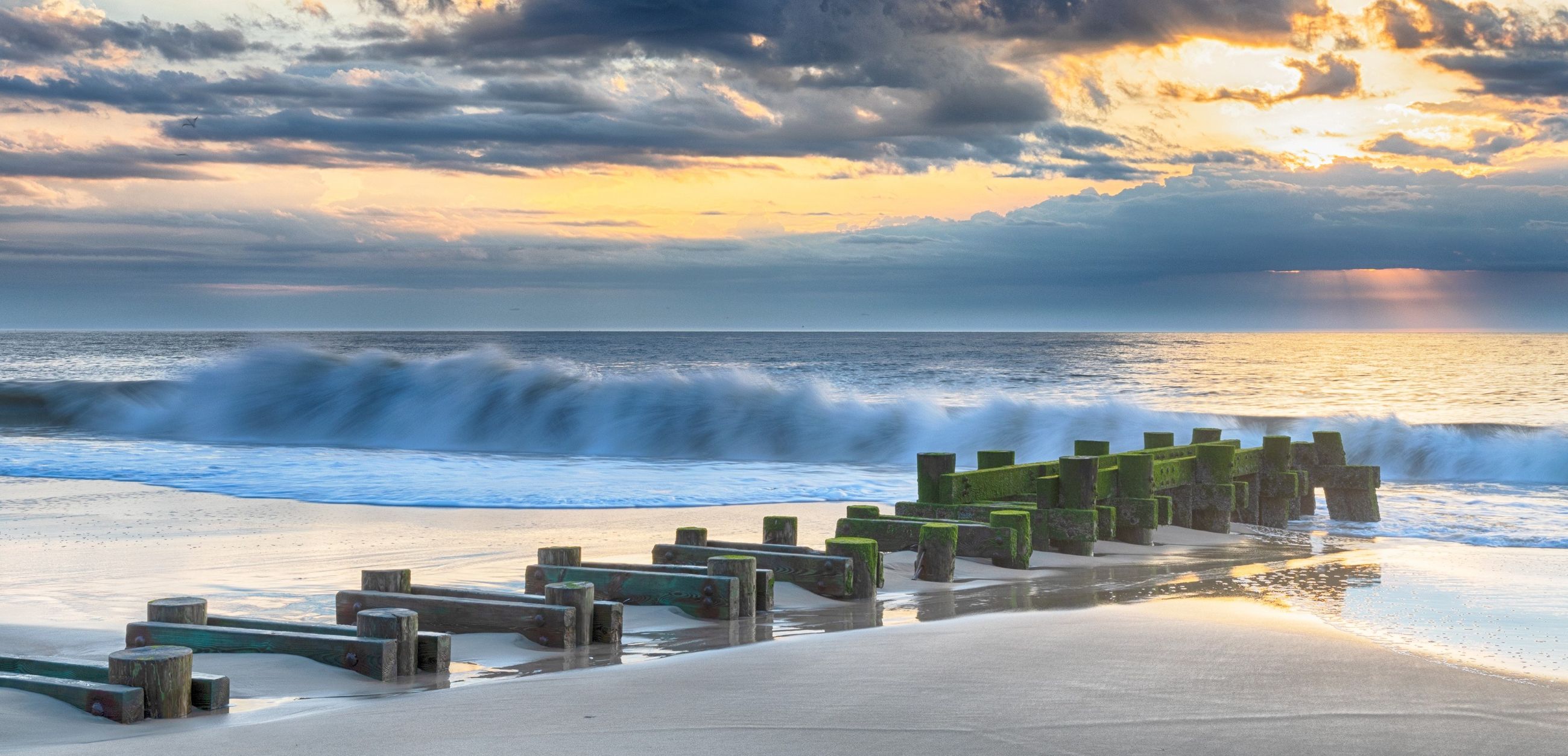 winter sunrise photo of jetty on Rehoboth Beach