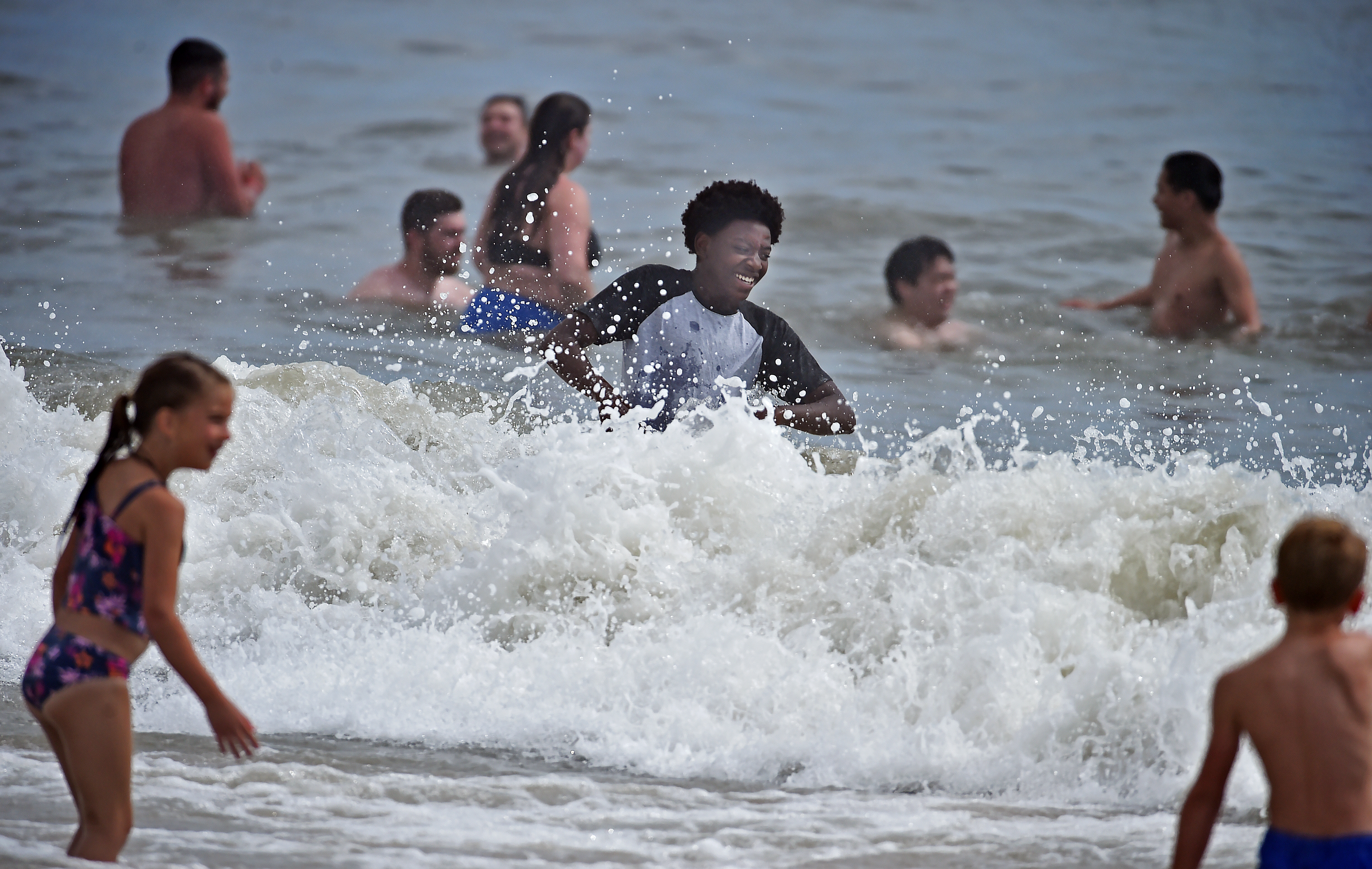 People enjoying the water at the beach