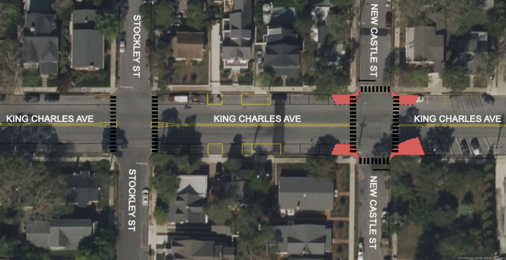 Aerial view of an intersection on King Charles Ave, with streets labeled Stockley St and New Castle St. Crosswalks and traffic markings are visible.