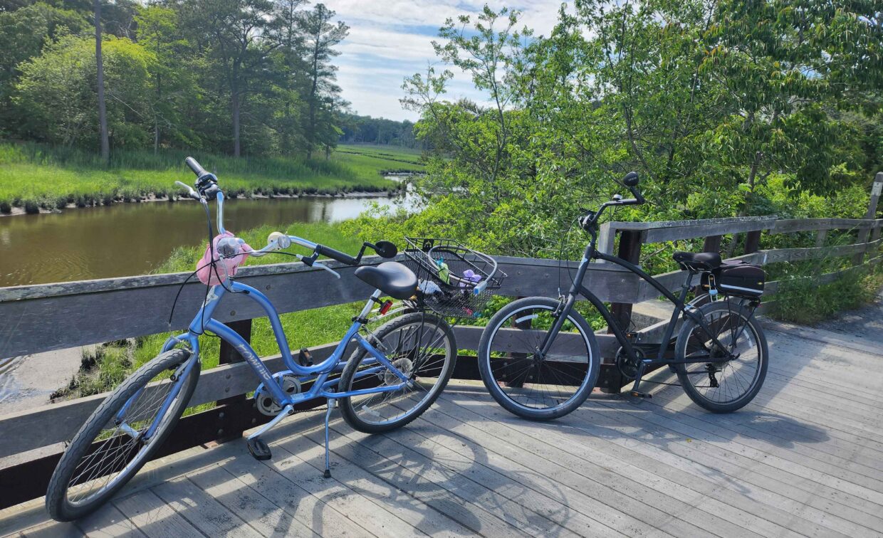 A 2024 Rehoboth Reflections-winning photo of two bikes on a wooden bridge along a bike trail