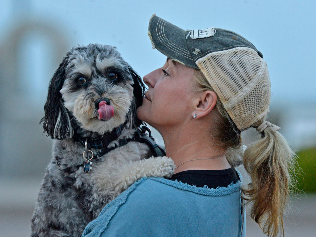 woman holding dog